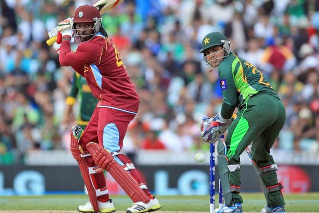 Chris Gayle of West Indies hits the ball to the boundary during the ICC Champions Trophy group B match