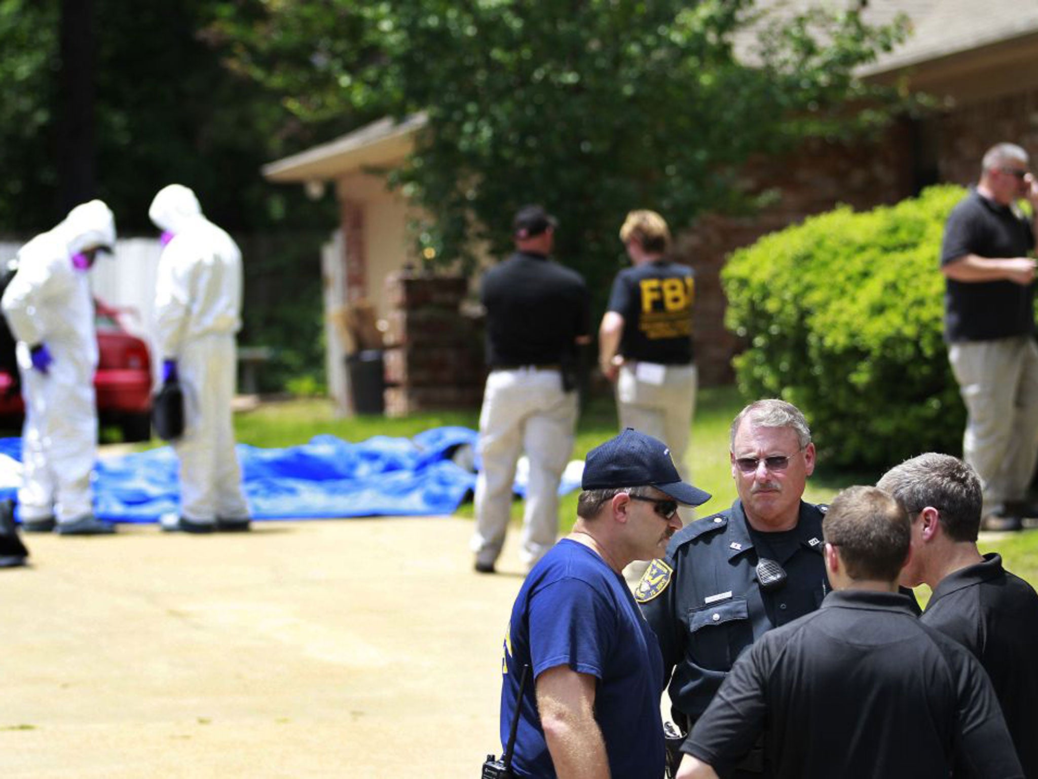 Authorities search a residence in New Boston, Texas in connection with a federal investigation surrounding ricin-laced letters mailed to President Barack Obama and New York Mayor Michael Bloomberg