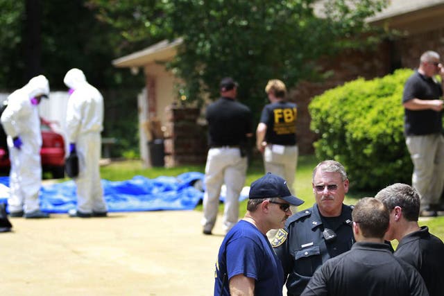 Authorities search a residence in New Boston, Texas in connection with a federal investigation surrounding ricin-laced letters mailed to President Barack Obama and New York Mayor Michael Bloomberg