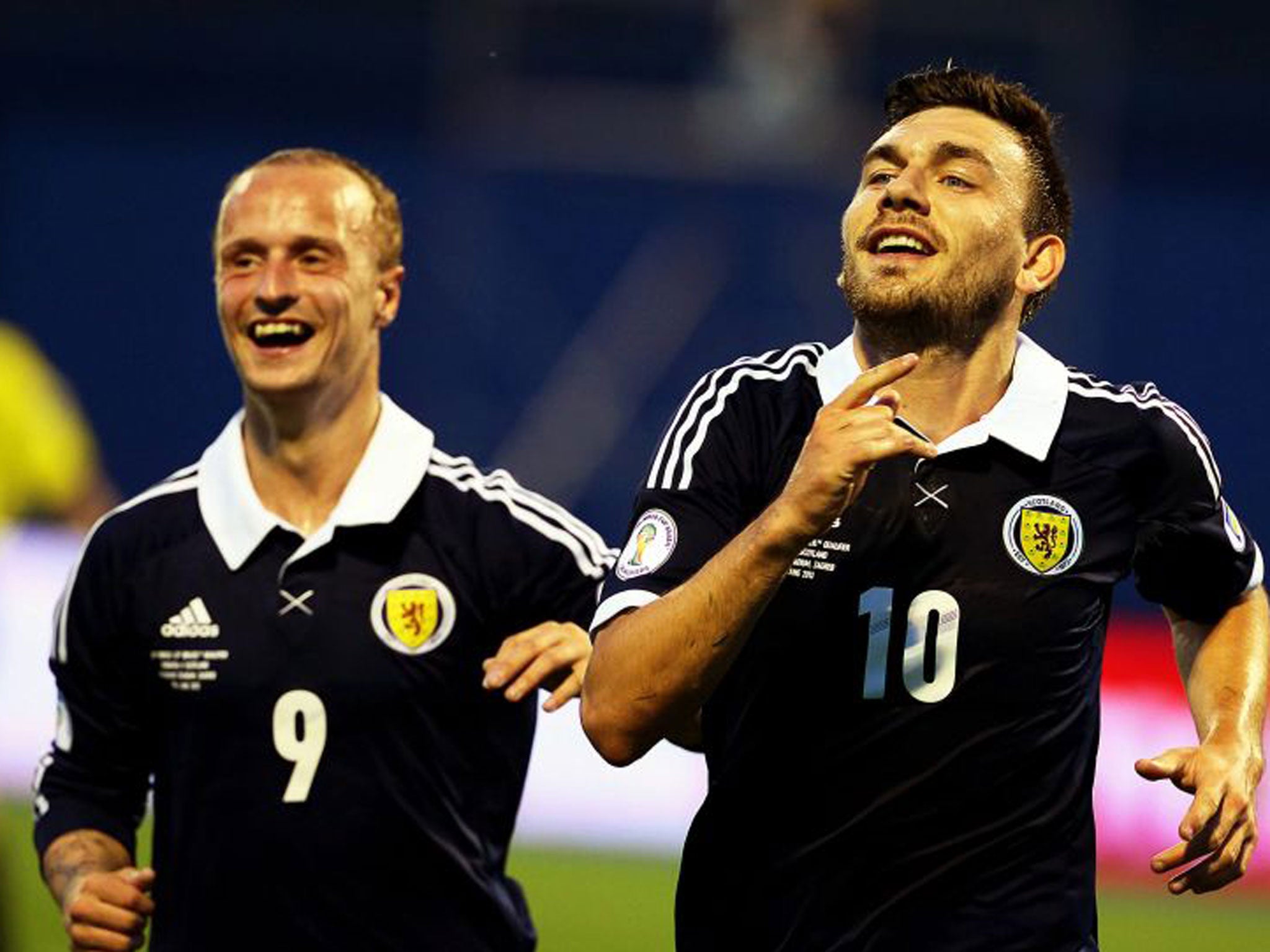 Scotland's Robert Snodgrass celebrates with his teammate Leigh Griffiths after scoring
