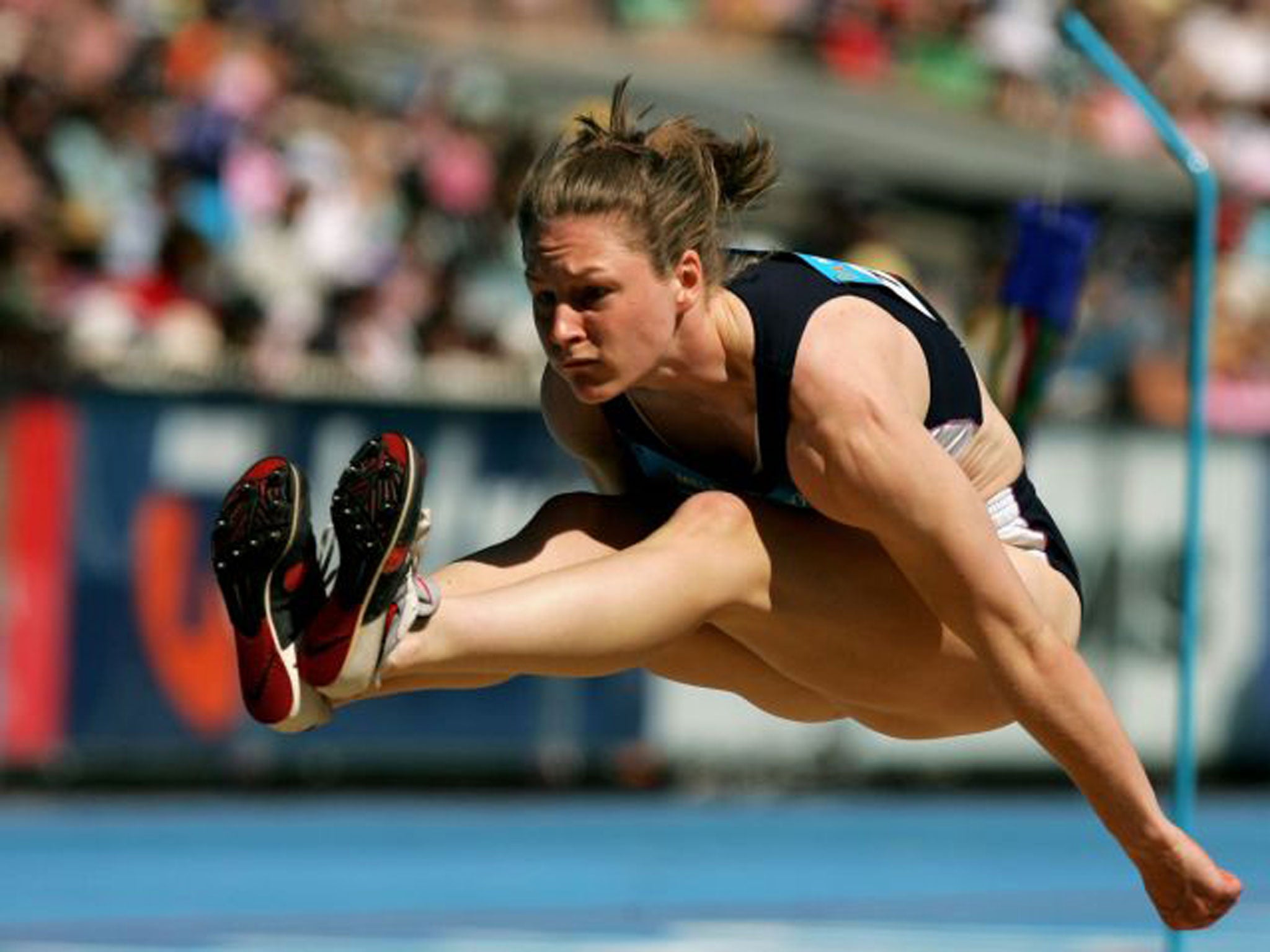 Feet first: Gillian Cooke competes in the long jump for Scotland at the 2006 Commonwealth Games in Melbourne