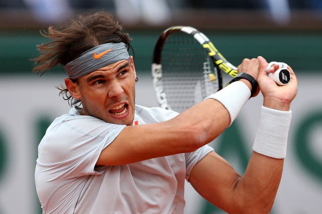Rafael Nadal of Spain plays a backhand during the Men's Singles final match against David Ferrer