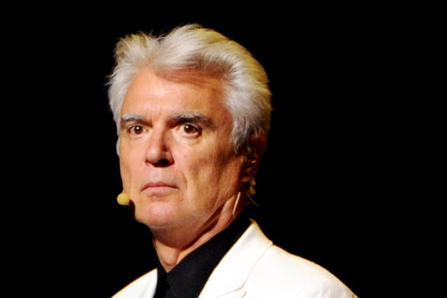 David Byrne took to the stage at Columbia University School of the Arts as a band played his song 'Road to Nowhere'. He then played a slideshow of graphs to illustrate how hopeless arts graduates are