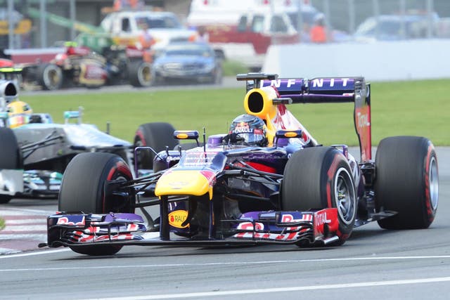 Red Bull’s Sebastian Vettel leads Mercedes’ Lewis Hamilton in Montreal