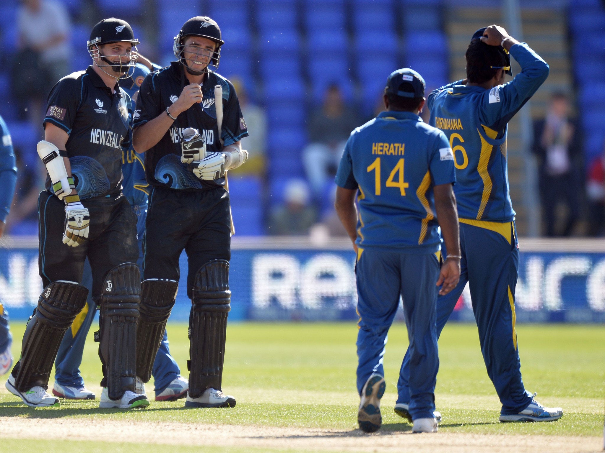 New Zealand’s Mitchell McClenaghan, left, and teammate Tim Southee, right, after clinching victory against Sri Lanka
