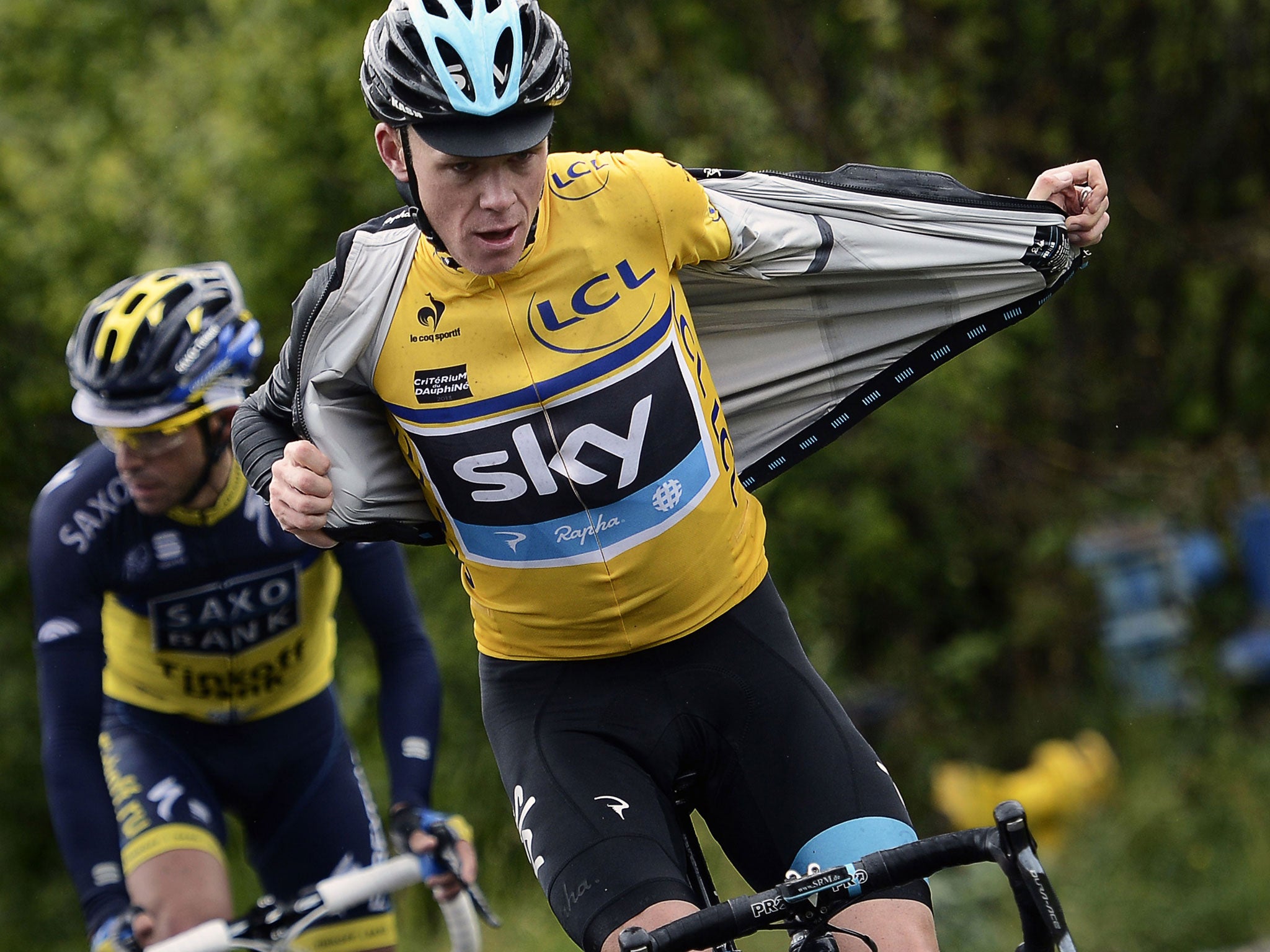 Chris Froome removes his raincoat as he rides during yesterday’s final stage between Sisteron and Risoul