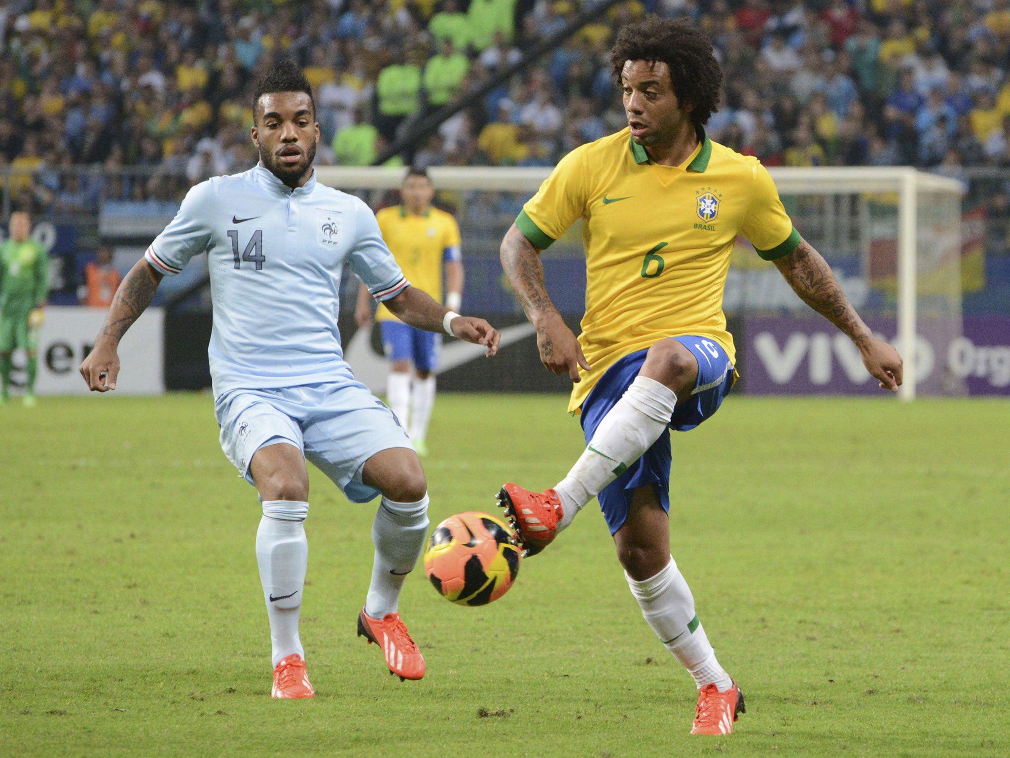 Marcelo, right, of Brasil fights for the ball during the friendly match between Brasil and France