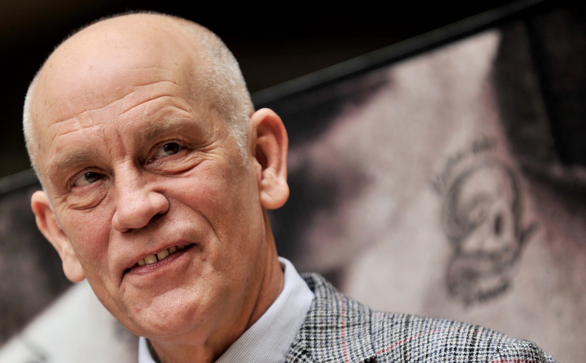 John Malkovich has been credited with saving the life of a 77-year-old man who accidentally slit his throat on scaffolding