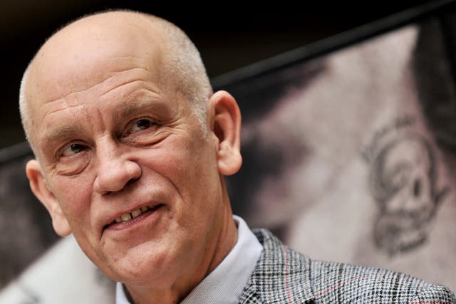 <p>John Malkovich has been credited with saving the life of a 77-year-old man who accidentally slit his throat on scaffolding</p>