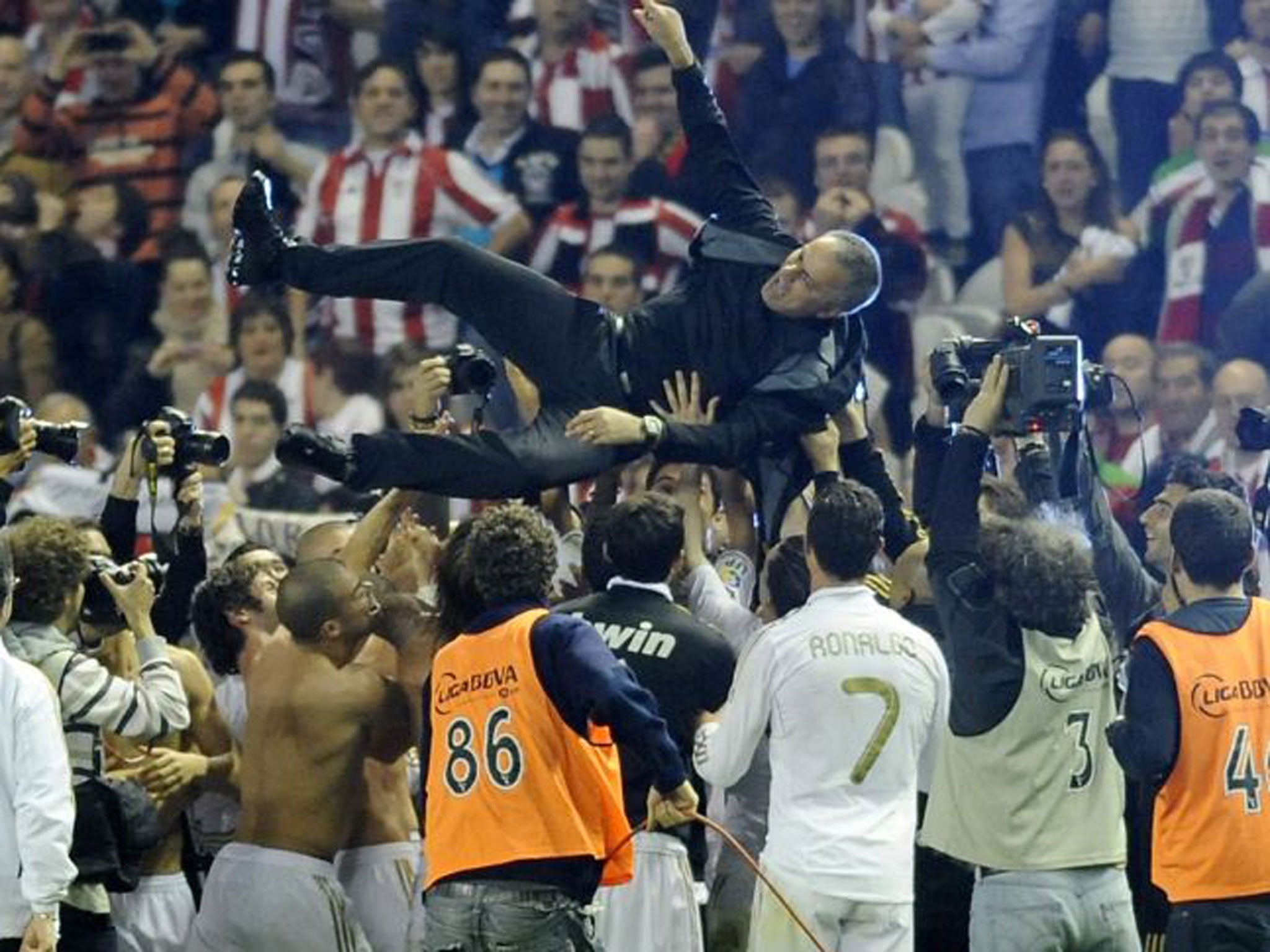 Happier days at Madrid as Jose Mourinho is hoisted aloft by his Real players