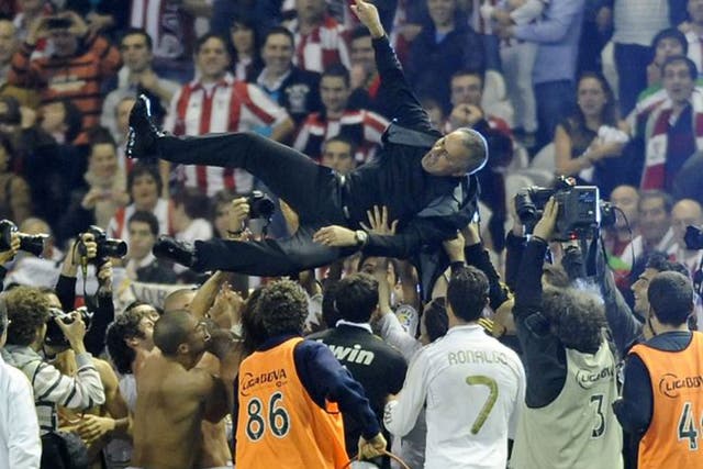 Happier days at Madrid as Jose Mourinho is hoisted aloft by his Real players