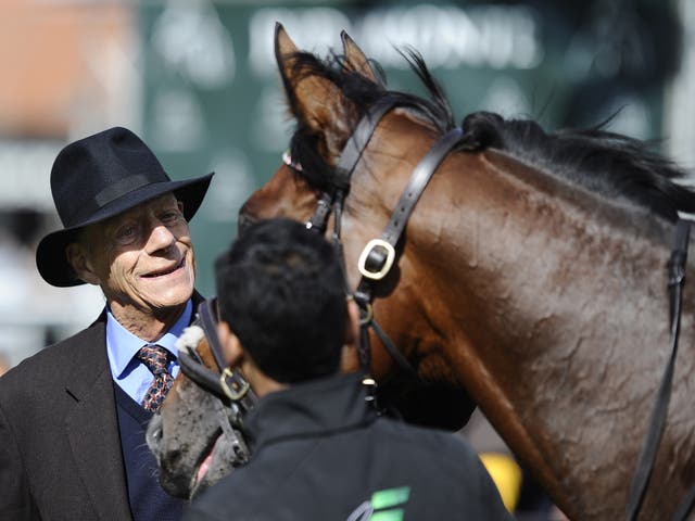 Sir Henry Cecil with Frankel at Newmarket racecourse on September 29, 2012