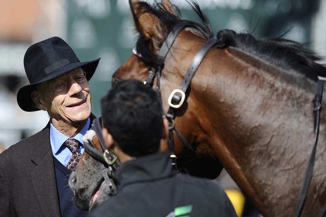 Sir Henry Cecil with Frankel at Newmarket racecourse on September 29, 2012