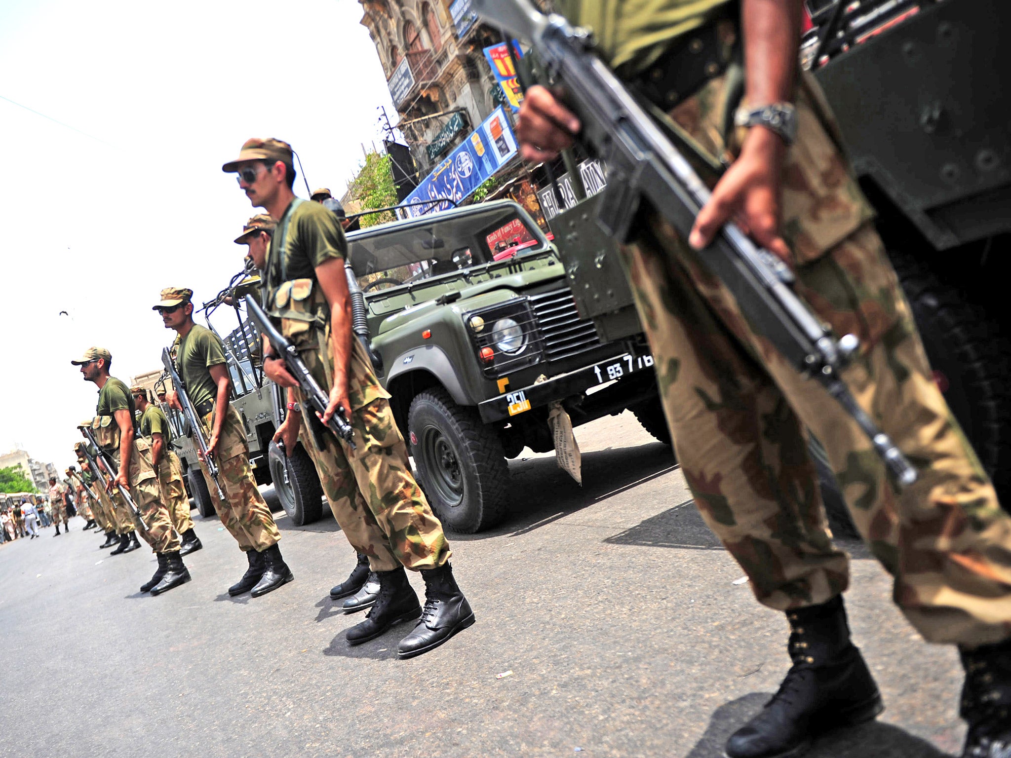 Pakistani soldiers standing guard in Karachi, ahead of last month's election