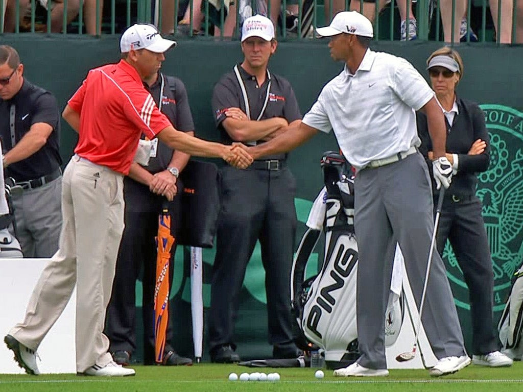 Sergio Garcia and Tiger Woods shake hands on Monday