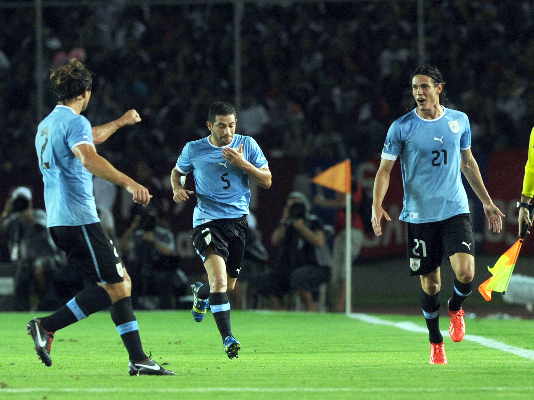 Edinson Cavani celebrates his goal for Uruguay against Venezuela in a World Cup qualifier