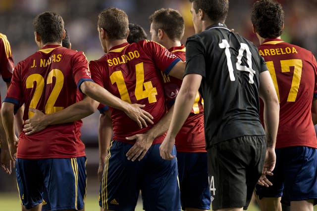 Spain's Roberto Soldado (14) is congratulated by teammates after scoring against Ireland during their friendly match June 11, 2013 at Yankee Stadium in New York