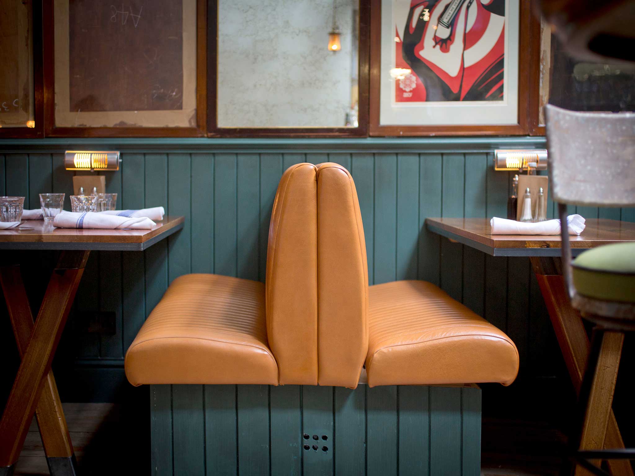 Artfully designed: The Fish & Chip Shop features grey tables, blue wood panels and 1940s furniture
