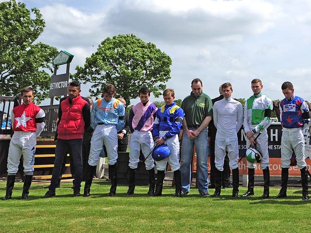 Jockeys at Great Yarmouth yesterday hold a minute’s silence in memory of Sir Henry Ceci