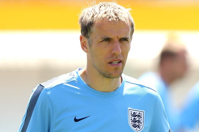 Phil Neville was part of the England under-21s coaching staff in Israel
