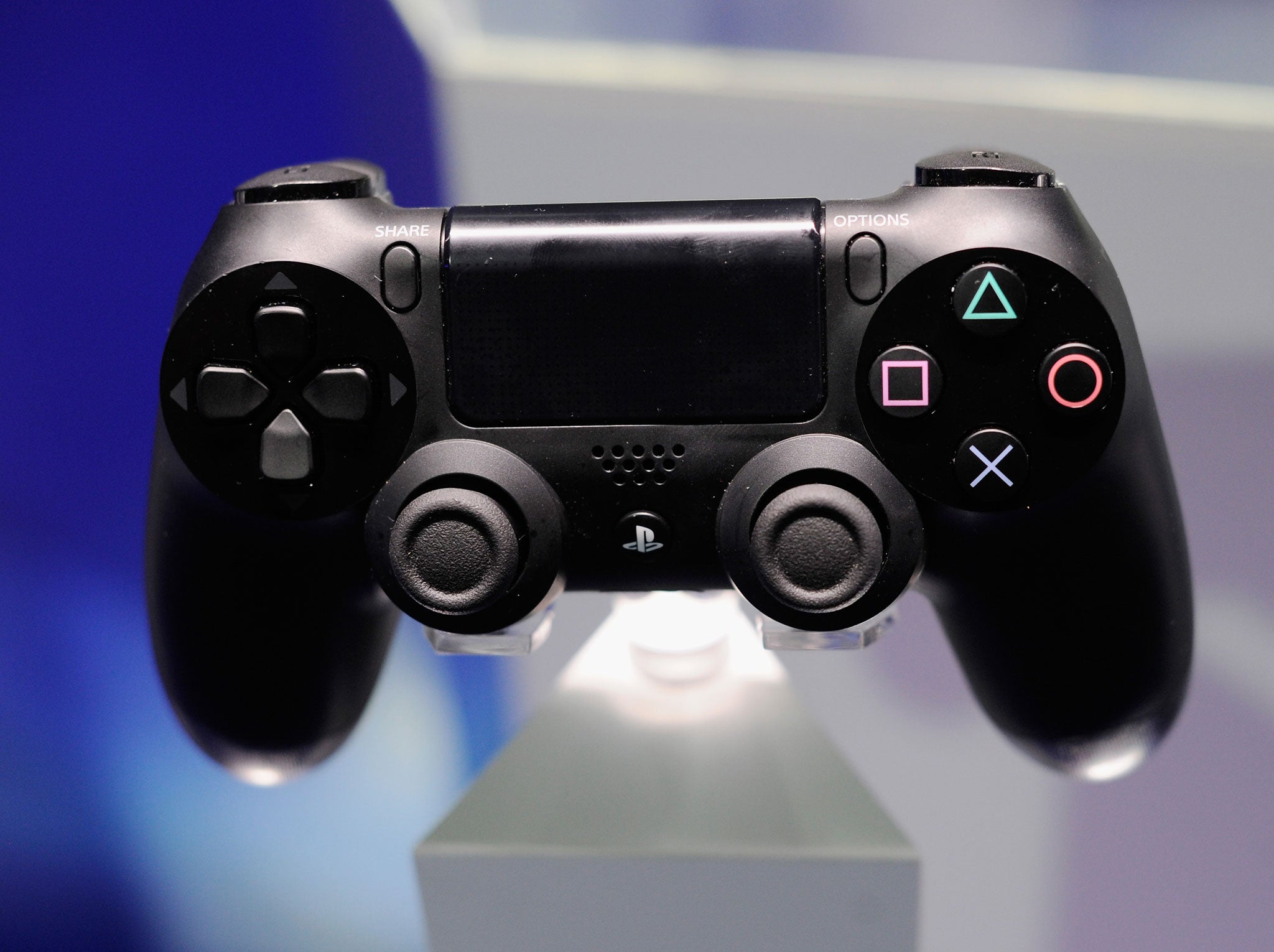 The DualShock 4 controller: heavier and 'grippier' with a touchpad and lightbar sensor.