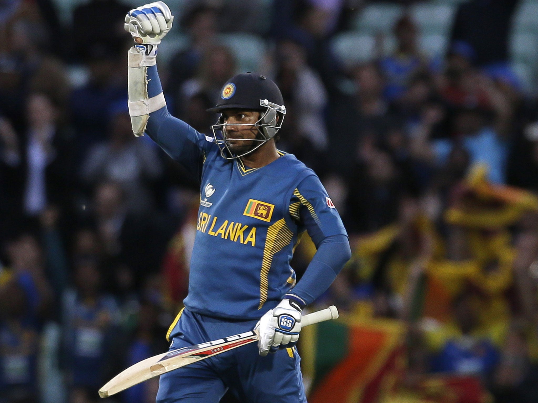 Sri Lanka's Kumar Sangakkara punches the air after he hit the winning runs to defeat England in  their ICC Champions Trophy cricket match at the Oval cricket ground in London