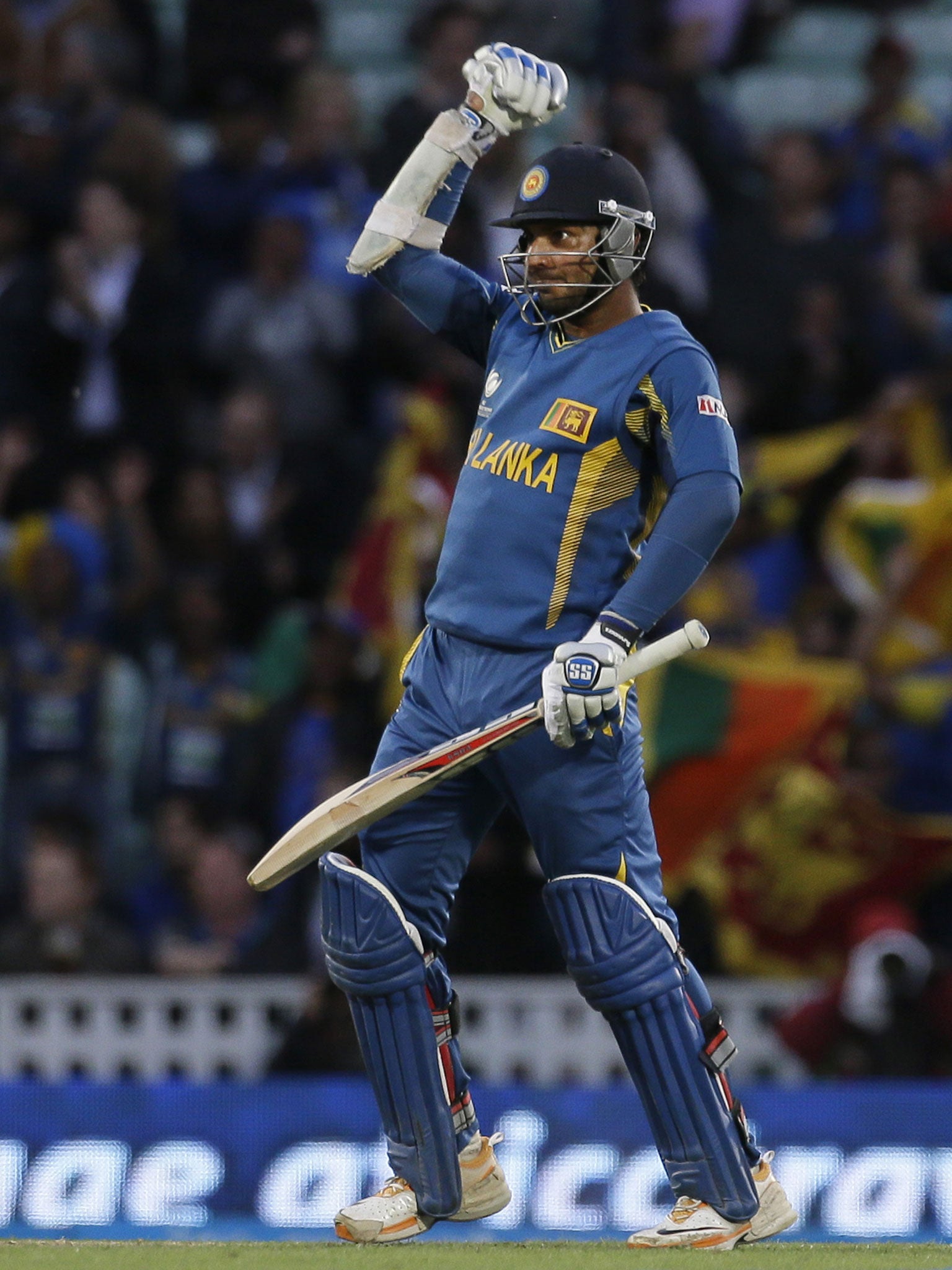 Sri Lanka's Kumar Sangakkara punches the air after he hit the winning runs to defeat England in their ICC Champions Trophy cricket match at the Oval cricket ground in London