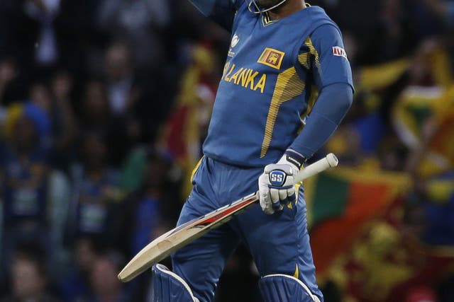 Sri Lanka's Kumar Sangakkara punches the air after he hit the winning runs to defeat England in their ICC Champions Trophy cricket match at the Oval cricket ground in London