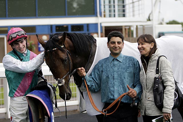 Jockey James Doyle, left, and trainer Lady Cecil, right, with Frankel’s half-brother Morpheus after winning the ABG Law Classic Maiden Stakes at Nottingham yesterday, two days after the death of Sir Henry Cecil