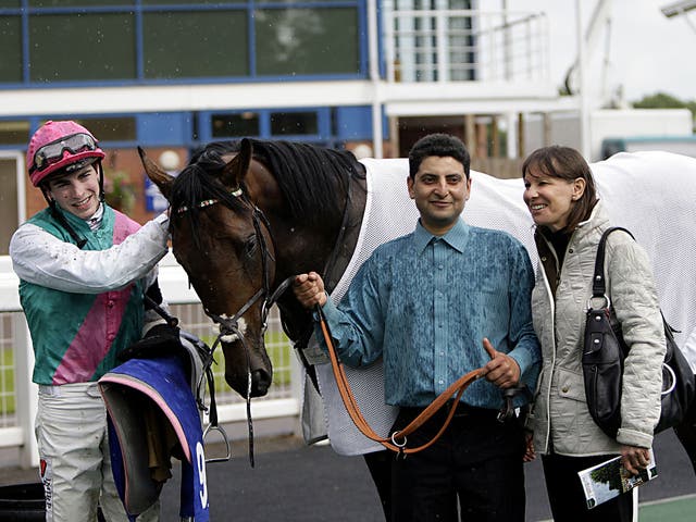 Jockey James Doyle, left, and trainer Lady Cecil, right, with Frankel’s half-brother Morpheus after winning the ABG Law Classic Maiden Stakes at Nottingham yesterday, two days after the death of Sir Henry Cecil