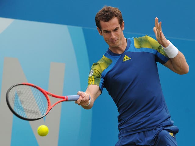 Andy Murray plays a return against France’s Nicolas Mahut