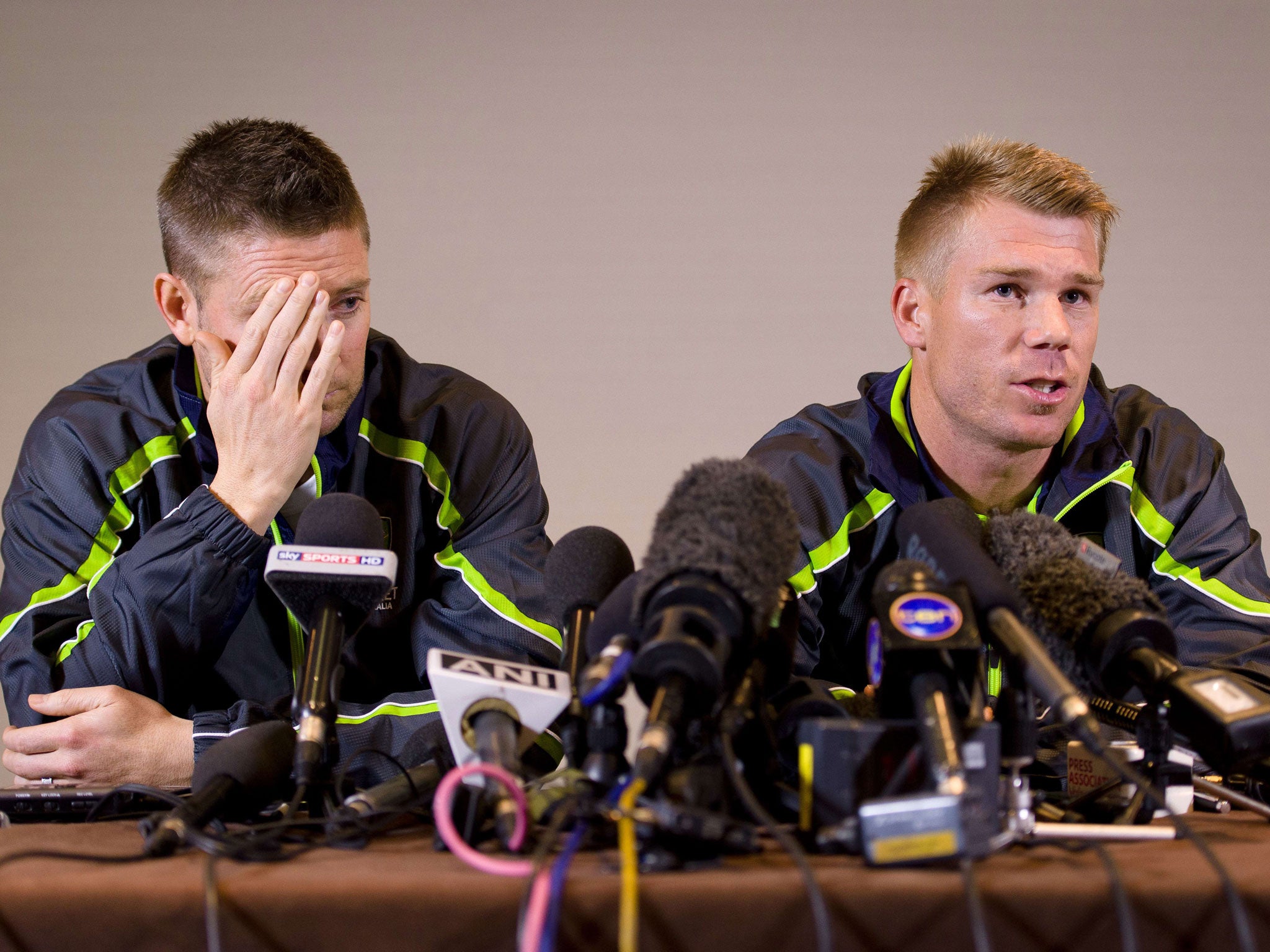 David Warner, right, and Michael Clarke, left, face the media