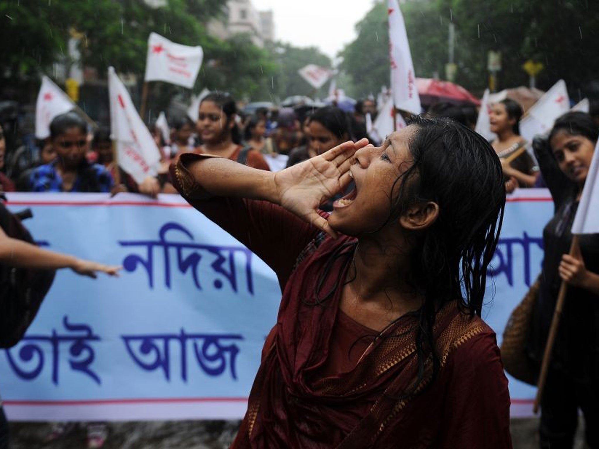 Students supporting various Leftist parties shout anti-government slogans during a protest following the recent gangrape and murder of a 20-year-old college student in Barasat, in Kolkata
