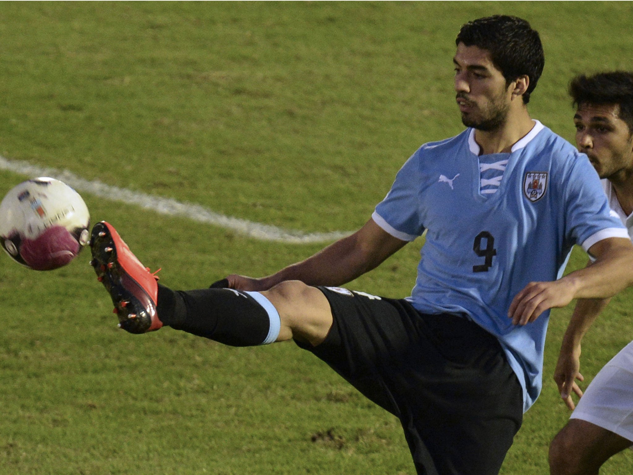 Luis Suarez controls the ball during Uruguay's friendly with France last week