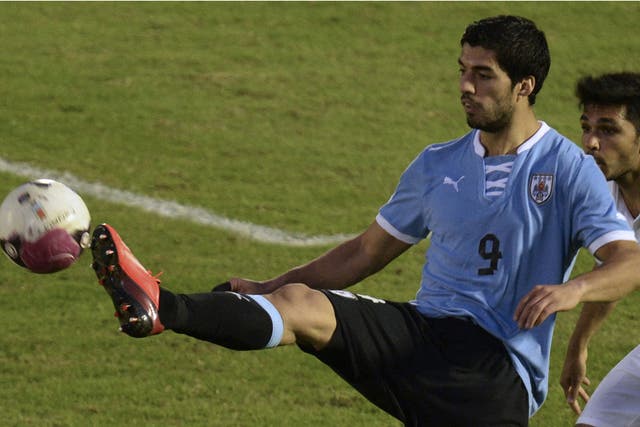 Luis Suarez controls the ball during Uruguay's friendly with France last week