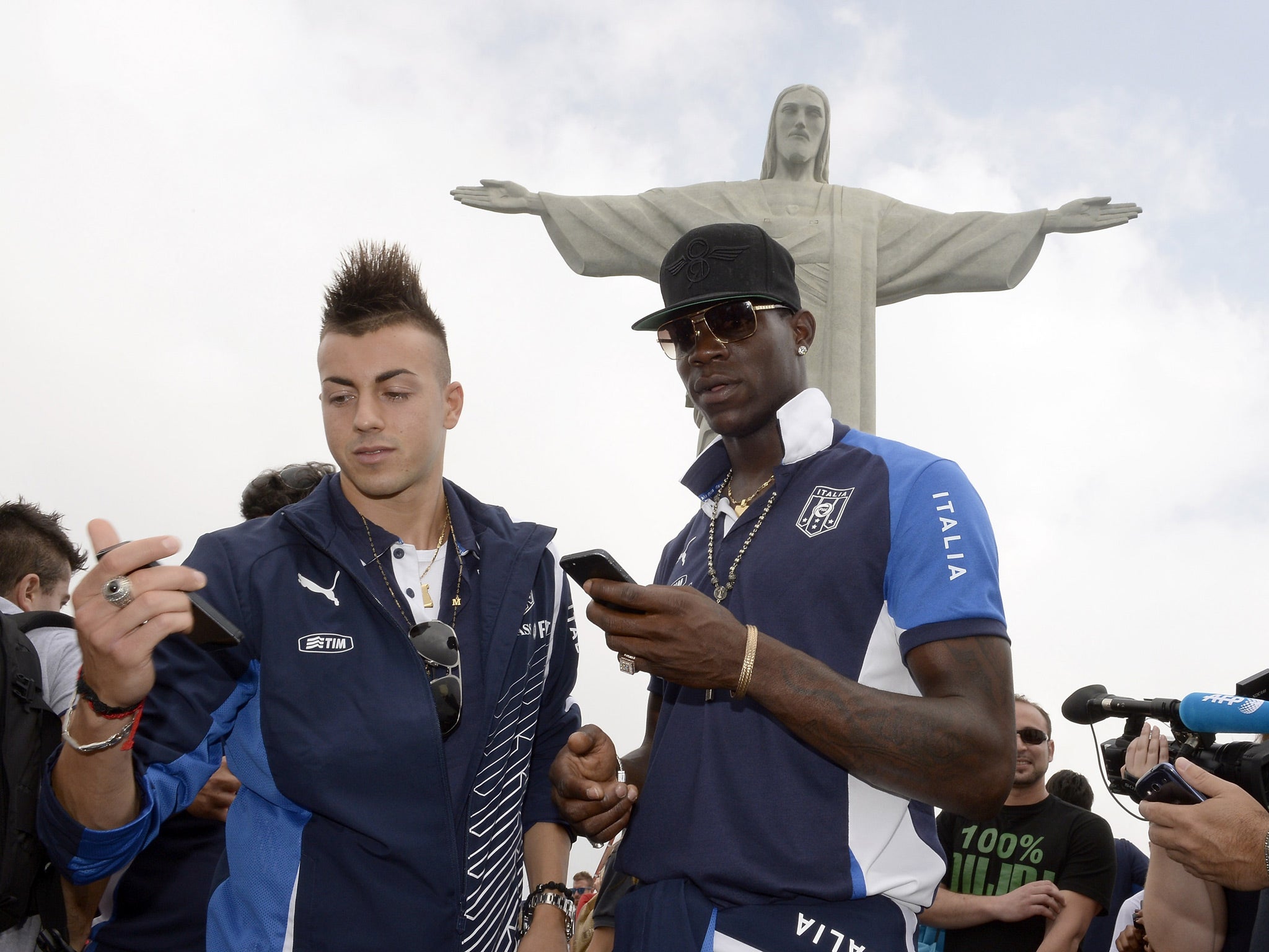 Stephan El Shaarawy and Mario Balotelli (R) of Italy visit the Christ the Redeemer Statue
