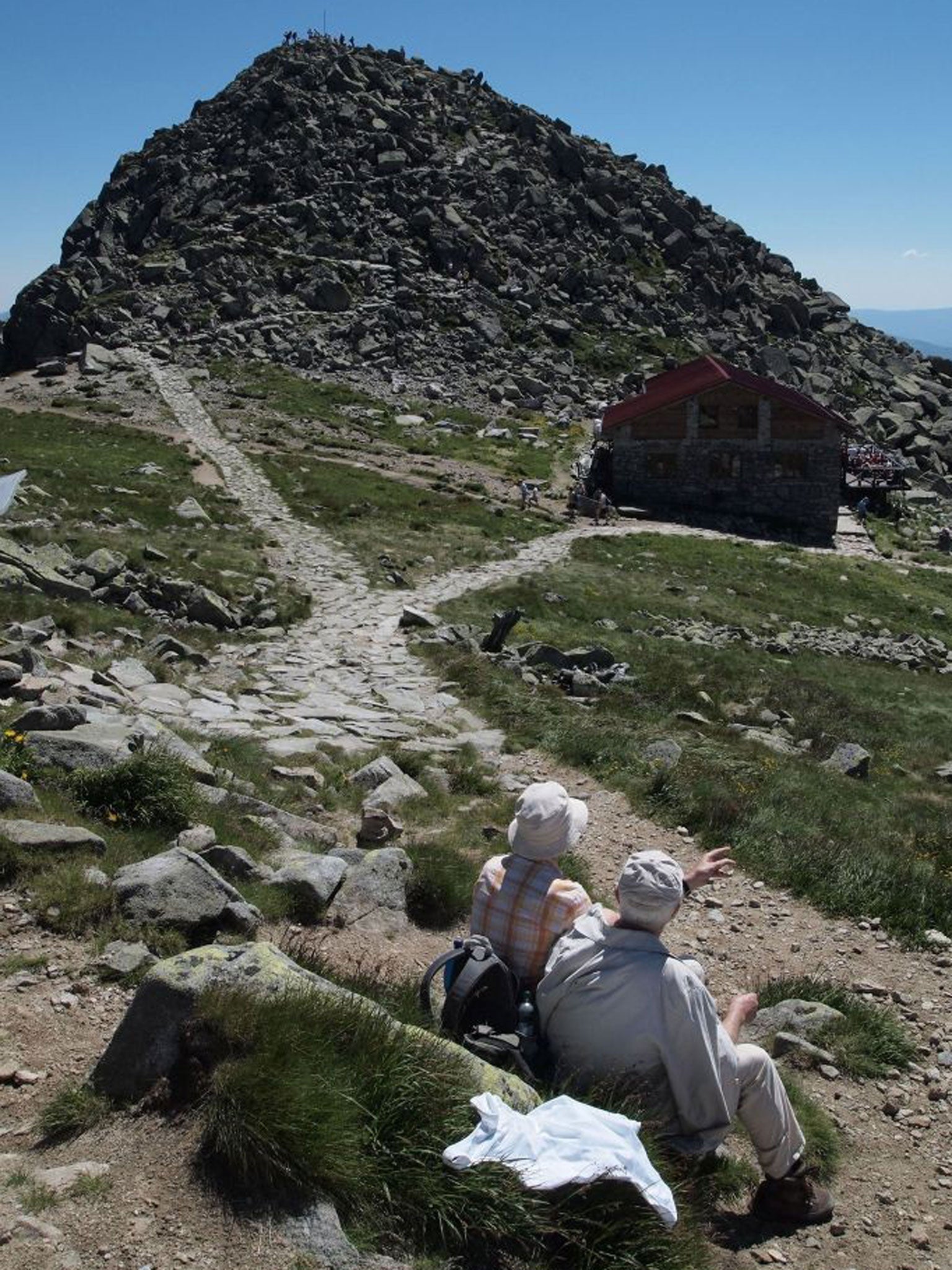An elderly couple take a quite moment near the peak of Chopok mountain in Low Tatra mountains