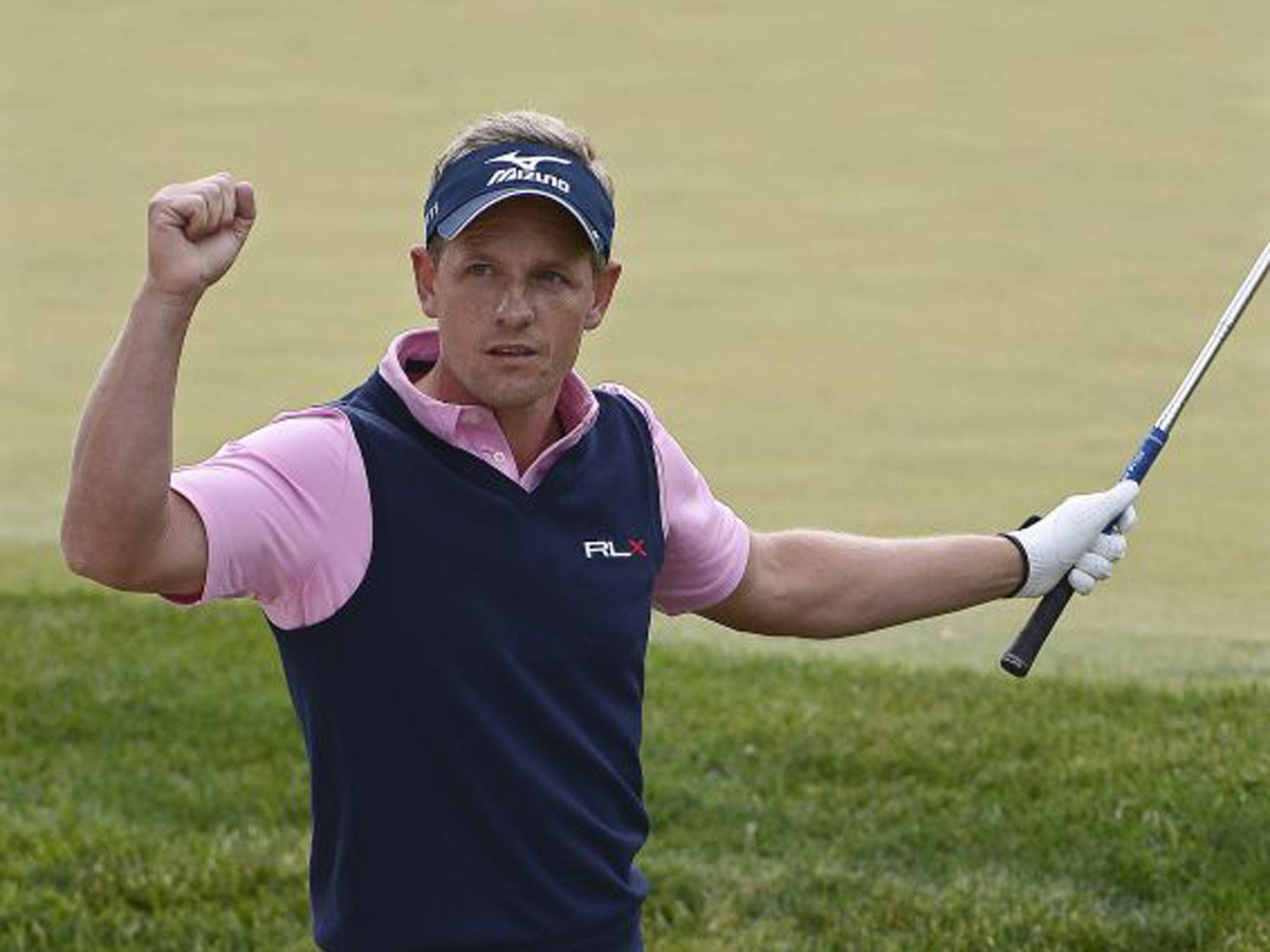 Luke Donald celebrates a birdie on the 13th during his second round