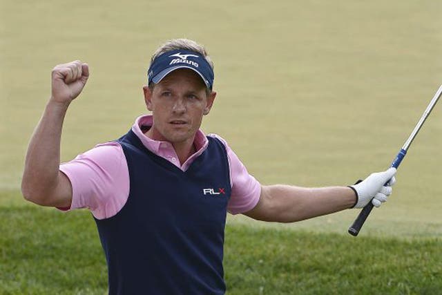 Luke Donald celebrates a birdie on the 13th during his second round