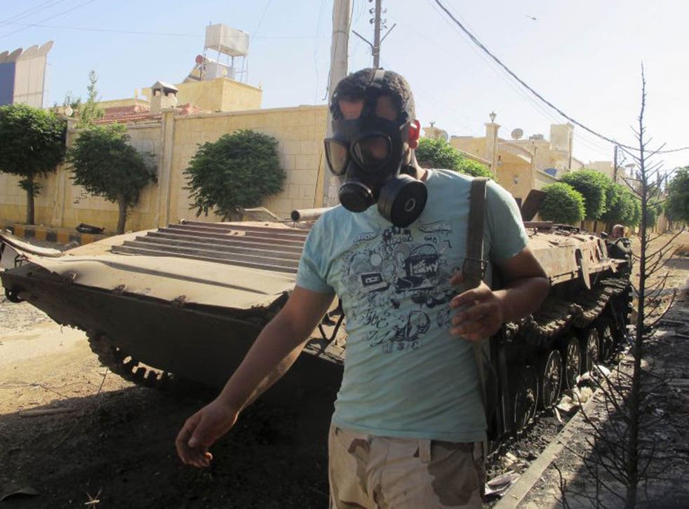 A Free Syrian Army fighter at a seized government camp near Idlib