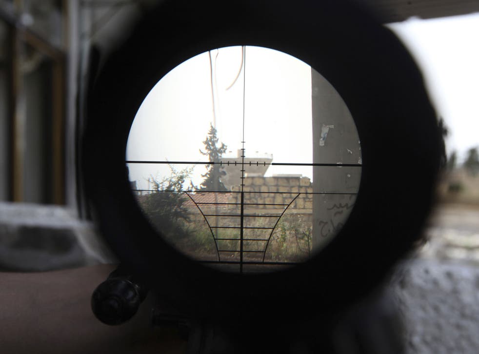The line of fire: A target in Aleppo seen through a sniper's sights