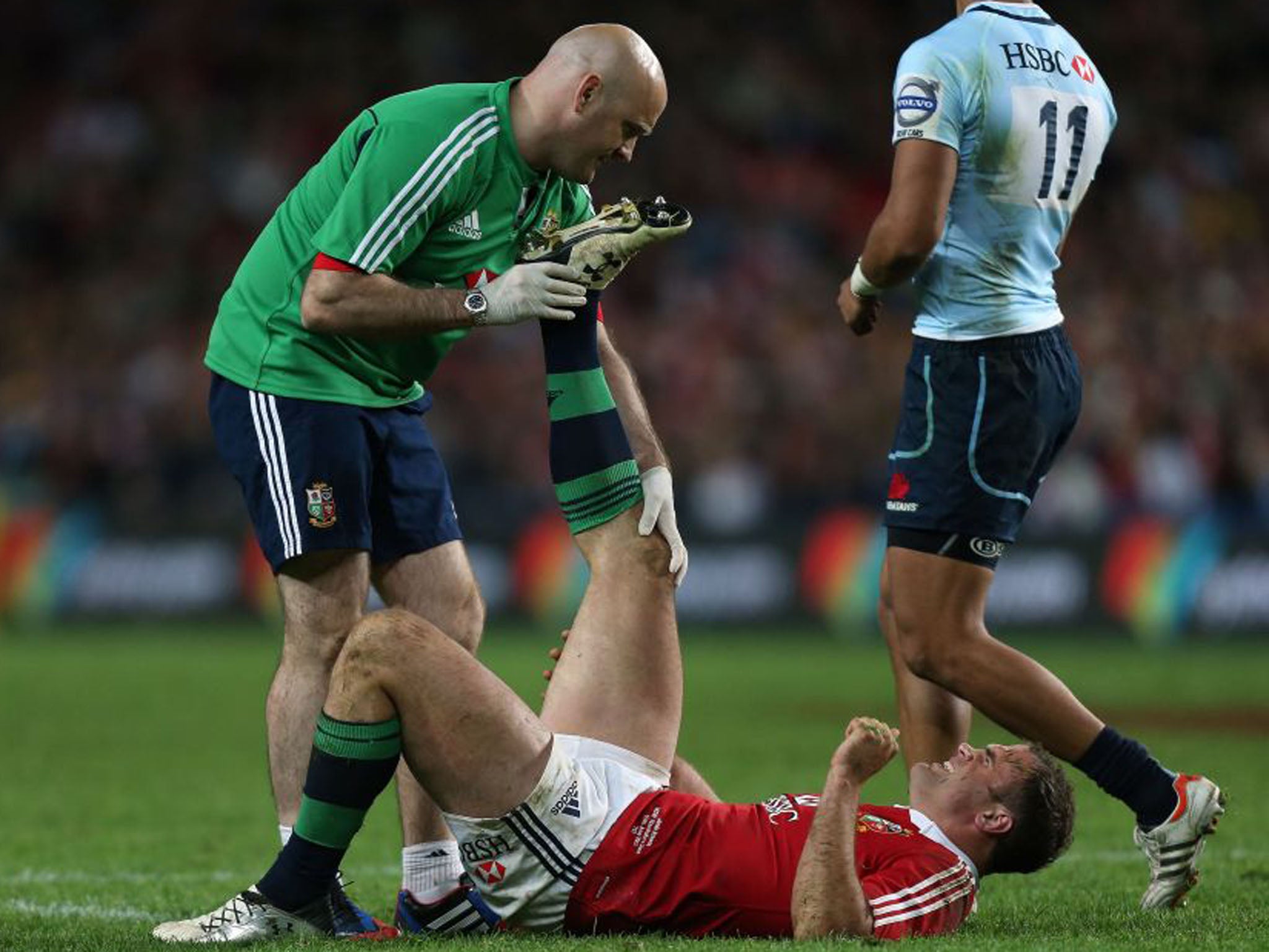 The Lions' Jamie Roberts looked in pain as he received treatment for an injury that could rule him out of the next match (David Davies/PA)