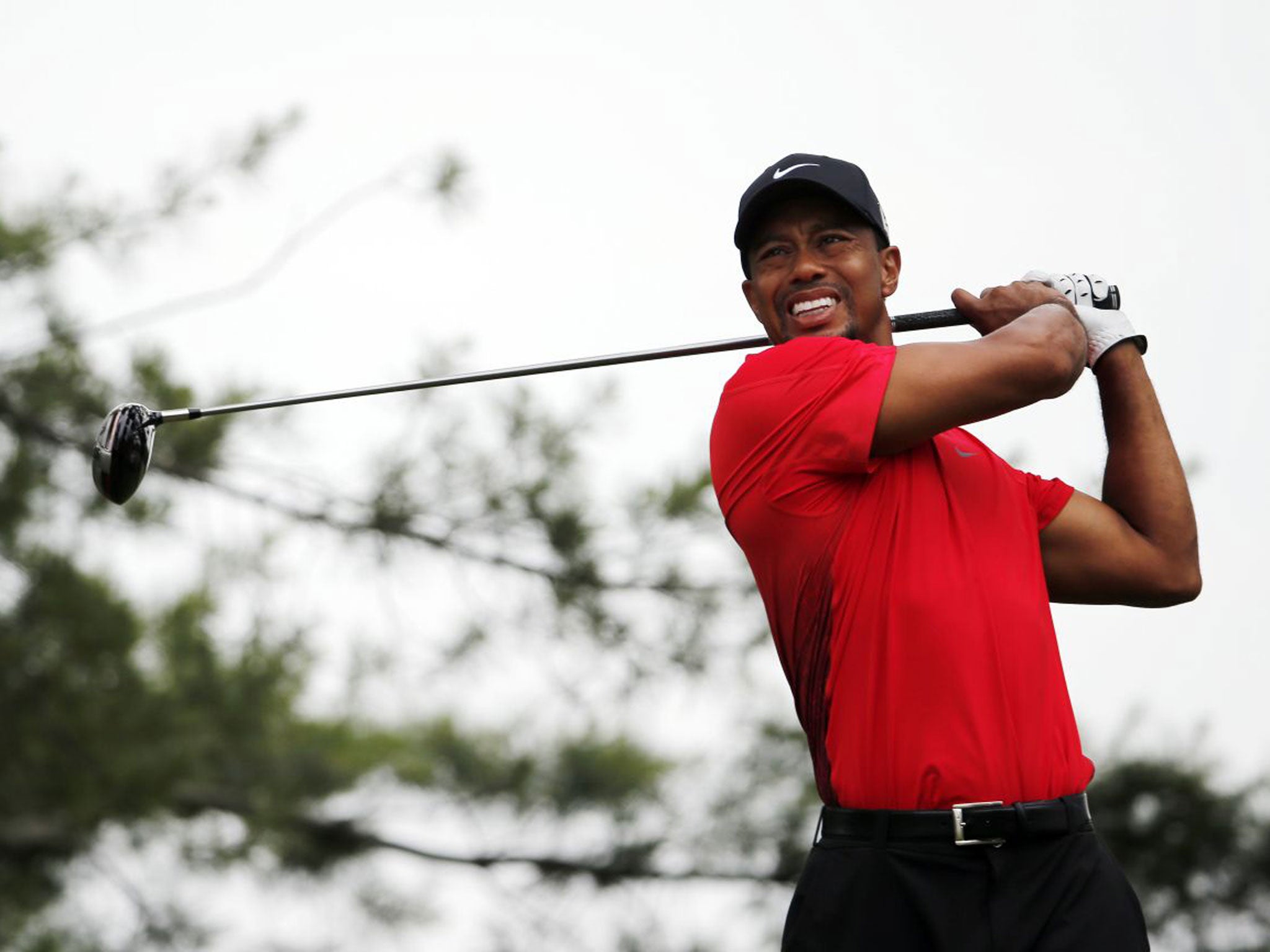 Tiger Woods strikes a tee shot on his way to a round of 74 yesterday in the US Open