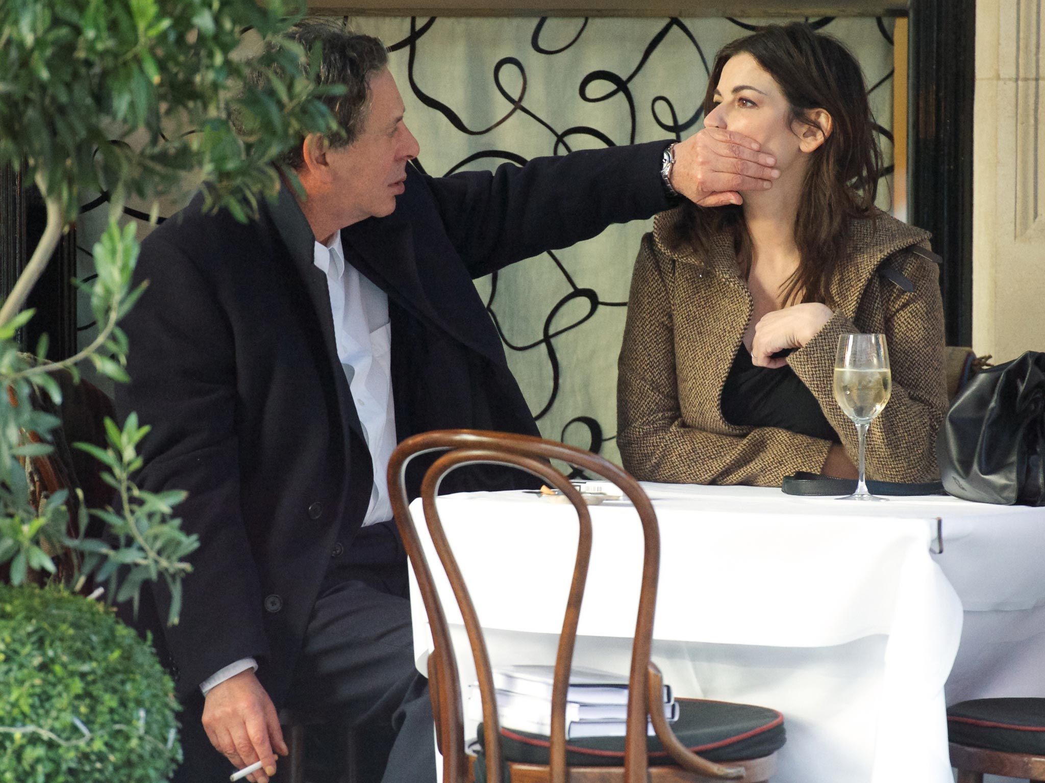 Charles Saatchi puts his hand over Nigella Lawson's mouth at Scott's in December