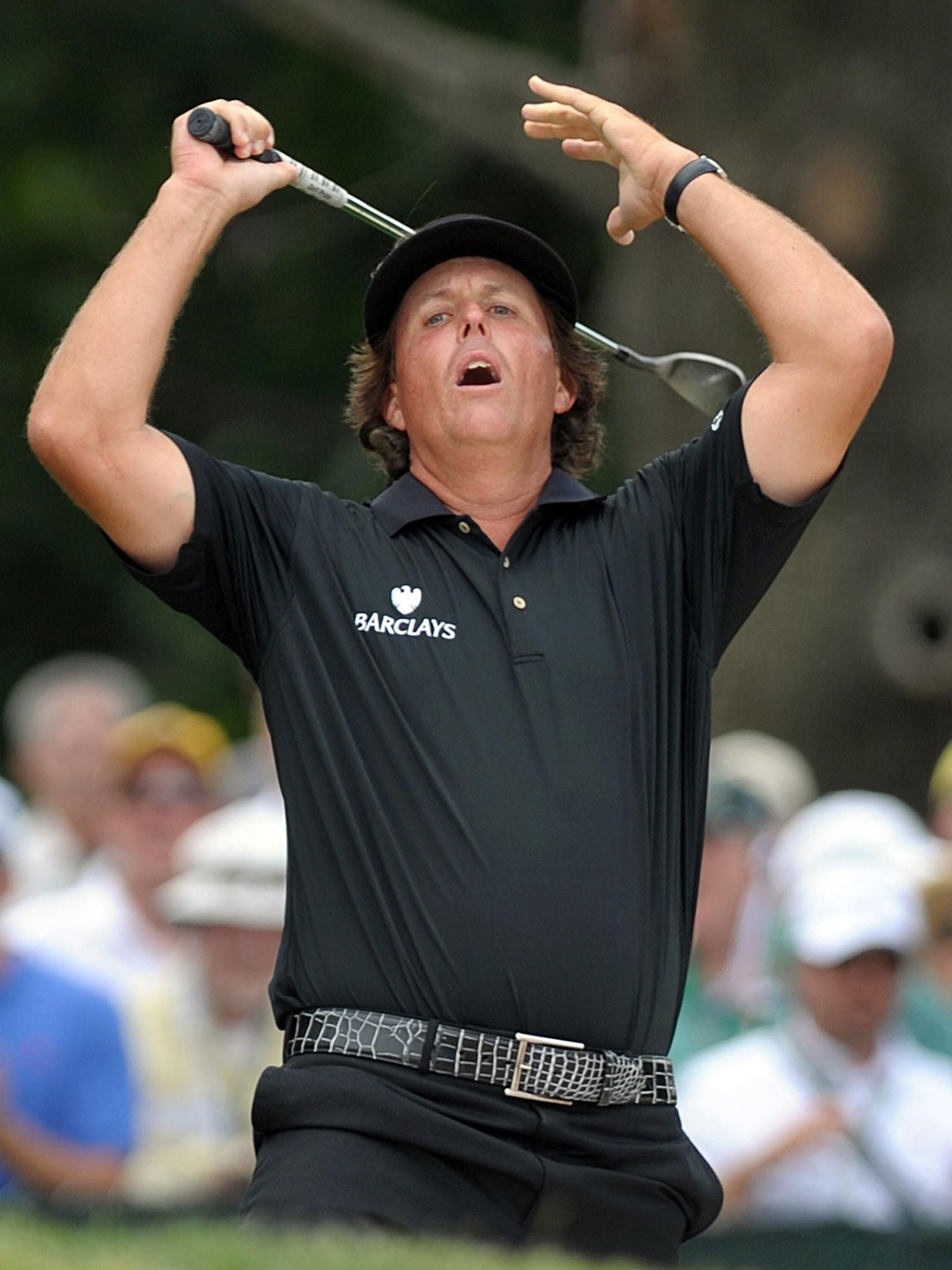 Phil Mickelson reacts to a missed eagle attempt in the last round