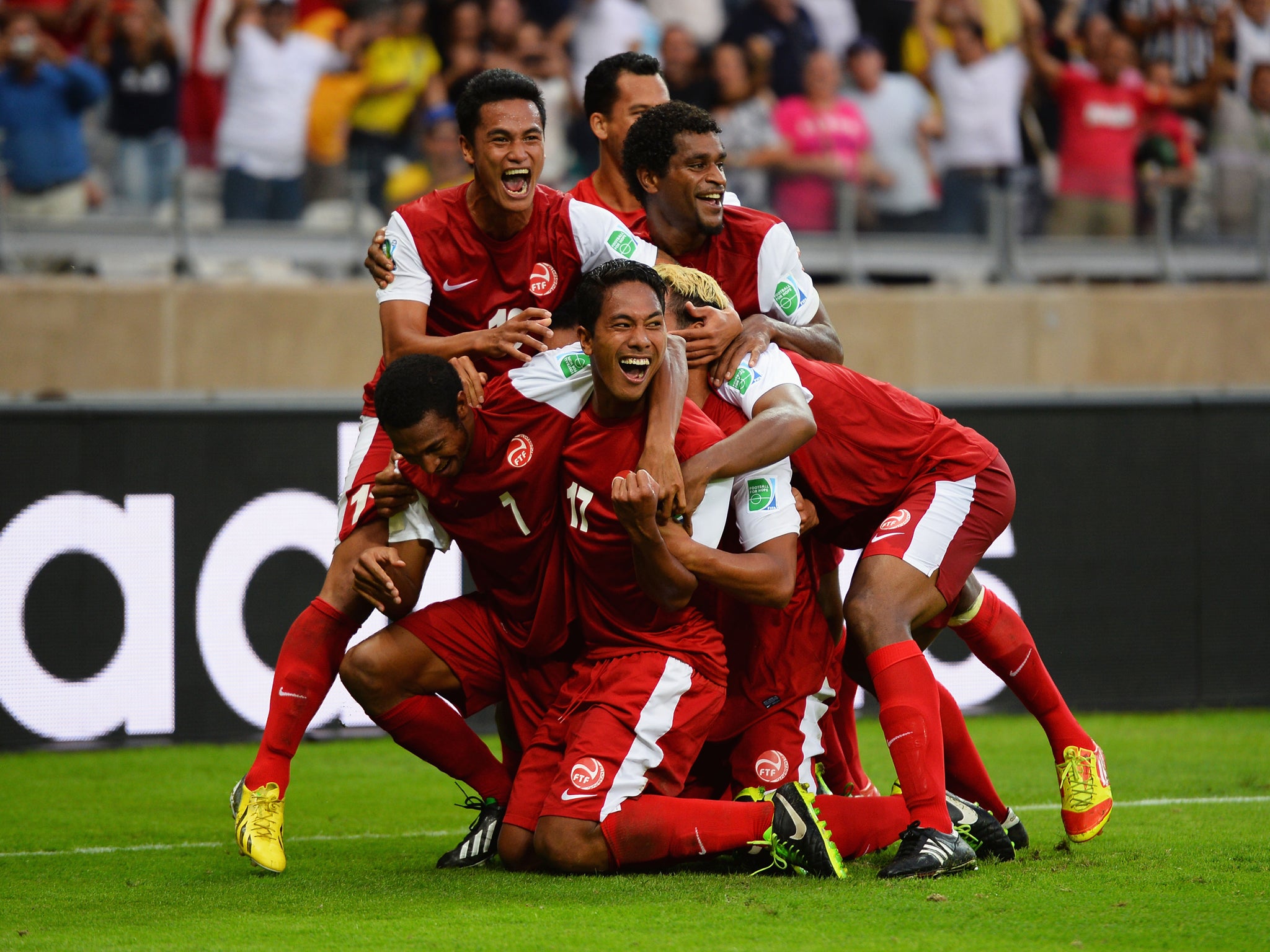 Jonathan Tehau celebrates a goal for Tahiti against Nigeria