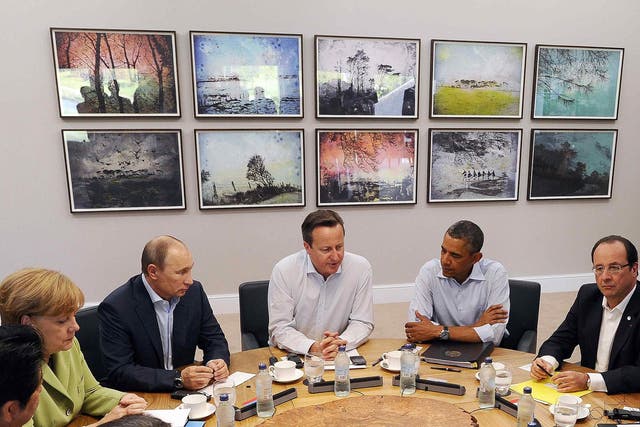 18 June 2013: Britain's Prime Minister David Cameron (centre) sits with U.S. President Barack Obama (second right), French President Francois Hollande (right), Russian President Vladimir Putin (third left), German Chancellor Angela Merkel (second left), and other G8 leaders, during the second Plenary Session of the G8 Summit, at Lough Erne, near Enniskillen, in Northern Ireland