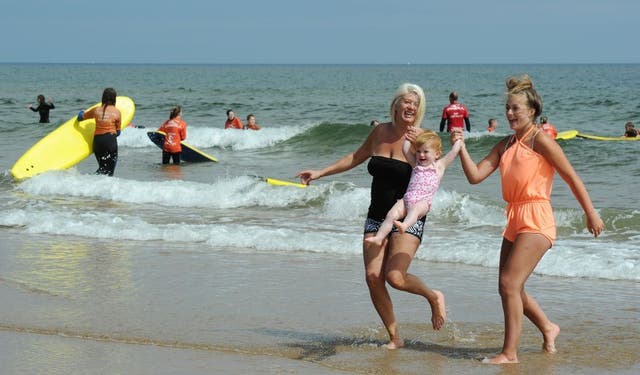 Sharon Jamesieson (left), 20-month-old Nadia and Nadia Jamesieson, aged 16, enjoy the sun on Tynemouth Beach