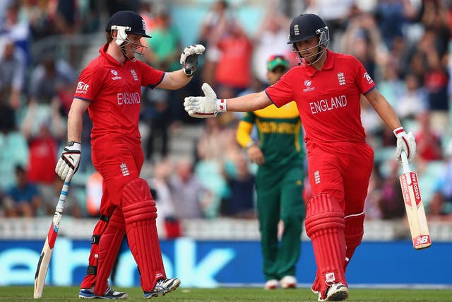 Jonathan Trott and Eoin Morgan of England celebrate hitting the winning runs as England secure a place in the final