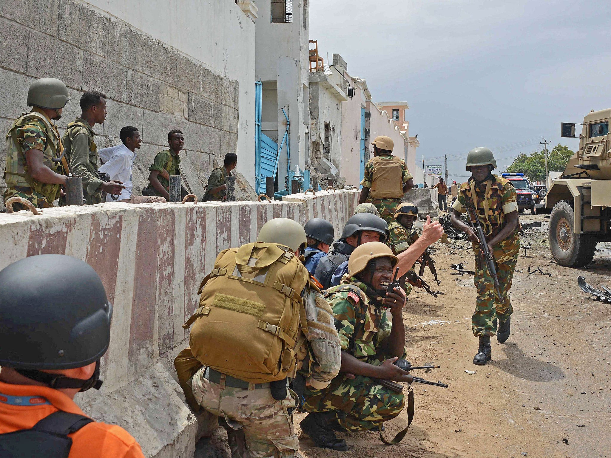 African Union peacekeepers take position outside the UN compound in Somalia